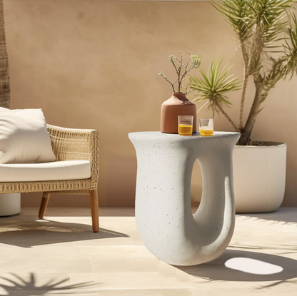 light concrete nordic U shaped side accent table in white with speckle patterns all over. Curvature is very smooth.