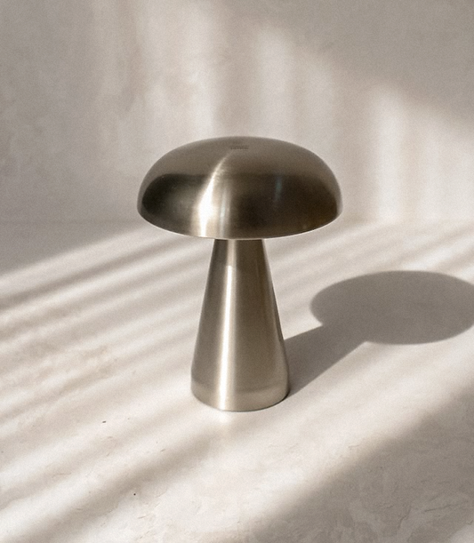 bar table mood lamp in colors of silver, gold and black. Touch sensitive control for dimming and temperature light from 3000 kelvin to 6000k. Material is made of steel and can be used as a decorative interior design piece with its bauhaus, retro, mid-century design.