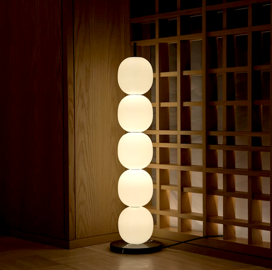 floor and table lamp option sizes. Night mood lamp has 2 to 5 circular soft edged gourd shapes stacked on eachother with a black robust steel frame. night lamp sets the tone/mood of the night with its light temperature option